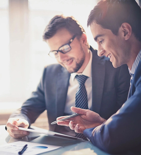 Businessmen reviewing documents together.