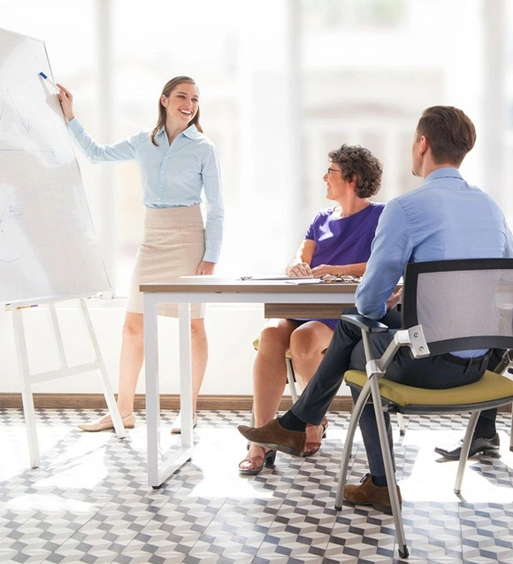 Businesswoman giving presentation to colleagues.